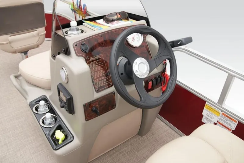 Slide: The Image of 2024 Sun Tracker Bass Buggy® 16 XL Select steering console with cup holders and controls. - 10