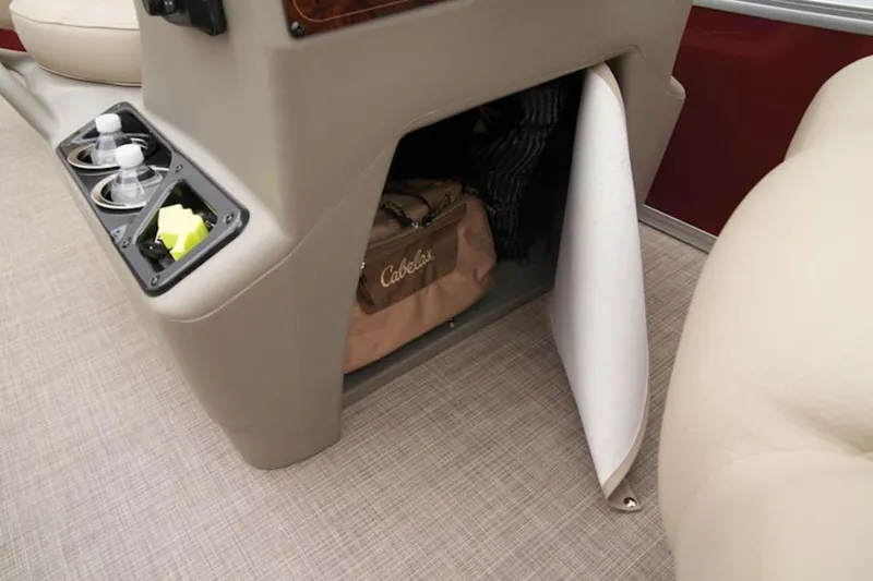 Slide: The Image of 2024 Sun Tracker Bass Buggy® 16 XL Select storage compartment with cup holders and gear bag. - 11