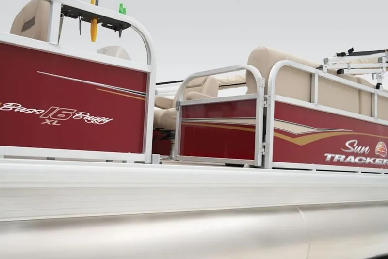Slide: The Image of 2024 Sun Tracker Bass Buggy® 16 XL Select pontoon boat, red exterior with beige seating. - 5
