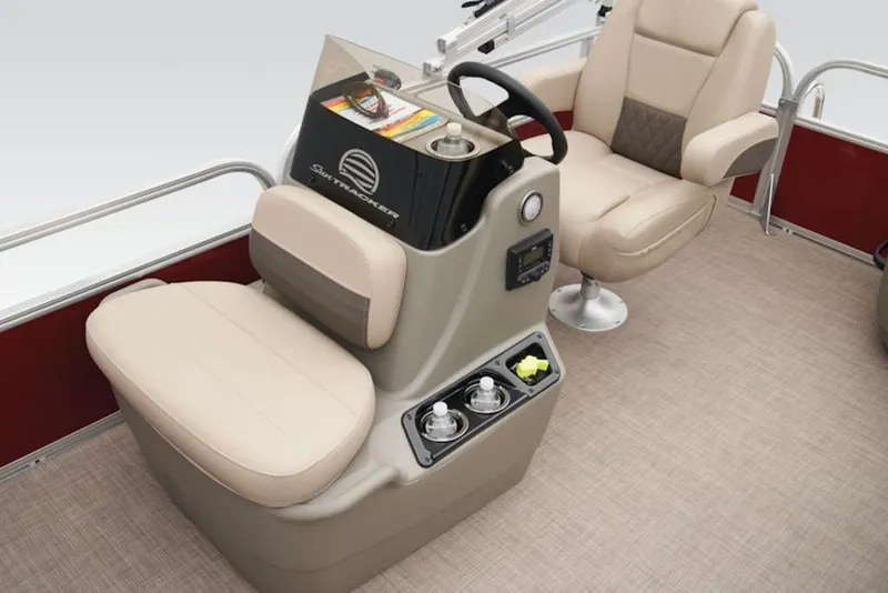 Slide: The Image of 2024 Sun Tracker Bass Buggy® 16 XL Select interior with beige seating and steering console. - 7