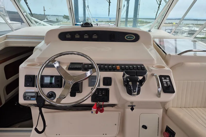 Slide: The Image of 2007 Grady-White Express 360 helm with steering wheel, controls, and navigation equipment. - 3