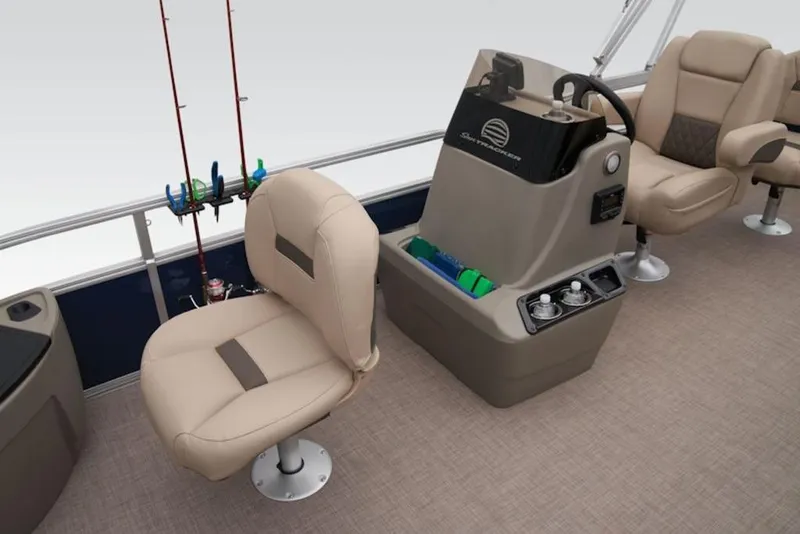 Slide: The Image of 2025 Sun Tracker BASS BUGGY® 18 DLX interior with beige seating and fishing rod holders. - 13