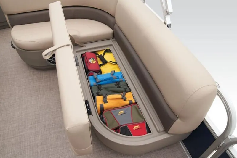 Slide: The Image of 2025 Sun Tracker BASS BUGGY® 18 DLX boat seat storage with colorful bags. - 5