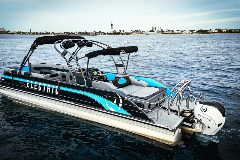 Slide: The Image of Electric Vision Marine Technologies V30 boat on water, showcasing sleek design and modern features. - 1
