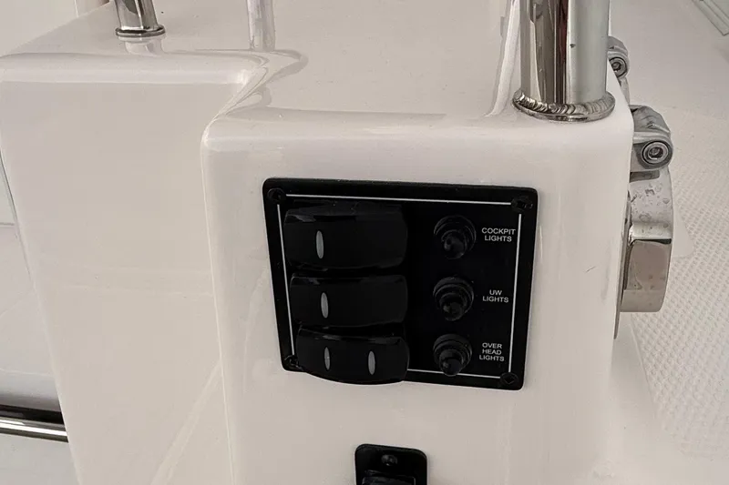 Slide: The Image of Control panel on 2025 Cutwater C-32 CB boat, featuring cockpit, underwater, and overhead light switches. - 11