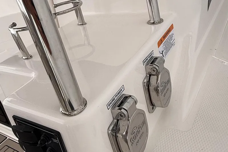 Slide: The Image of 2025 Cutwater C-32 CB boat with shore power connections and stainless steel fixtures. - 12