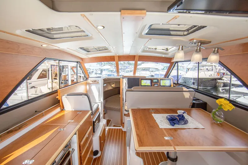 Slide: The Image of Manufacturer Provided Image: Luxurious 2025 Cutwater C-32 CB yacht interior with modern design and elegant wood finishes. - 32