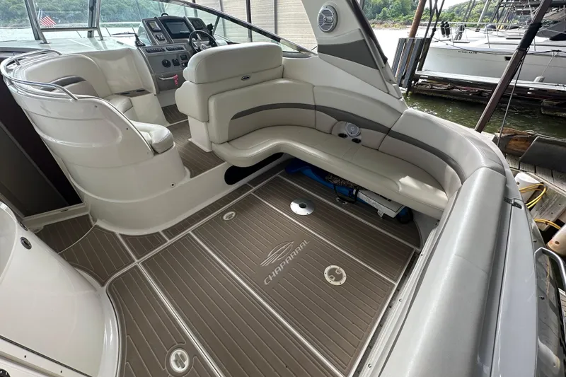 Slide: The Image of 2010 Chaparral Signature 370 boat interior with seating and control panel. - 15