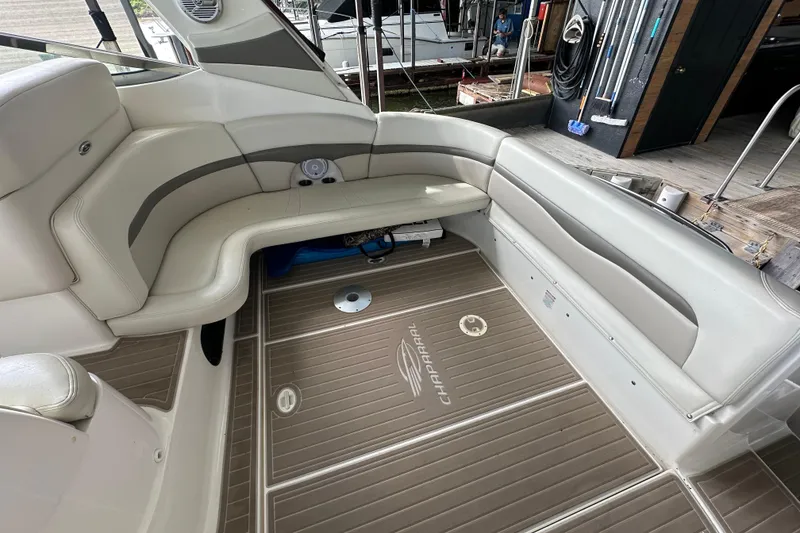 Slide: The Image of Interior of 2010 Chaparral Signature 370 boat with beige seating and branded flooring. - 16
