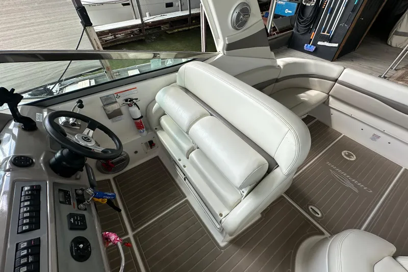 Slide: The Image of 2010 Chaparral Signature 370 boat interior with steering wheel, seating, and control panel. - 26