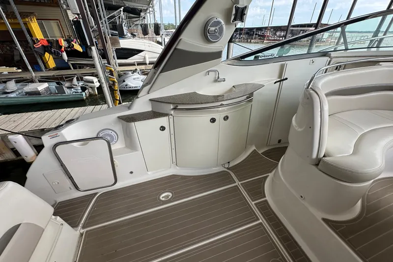 Slide: The Image of 2010 Chaparral Signature 370 interior with stainless steel cabinet and storage space. - 28