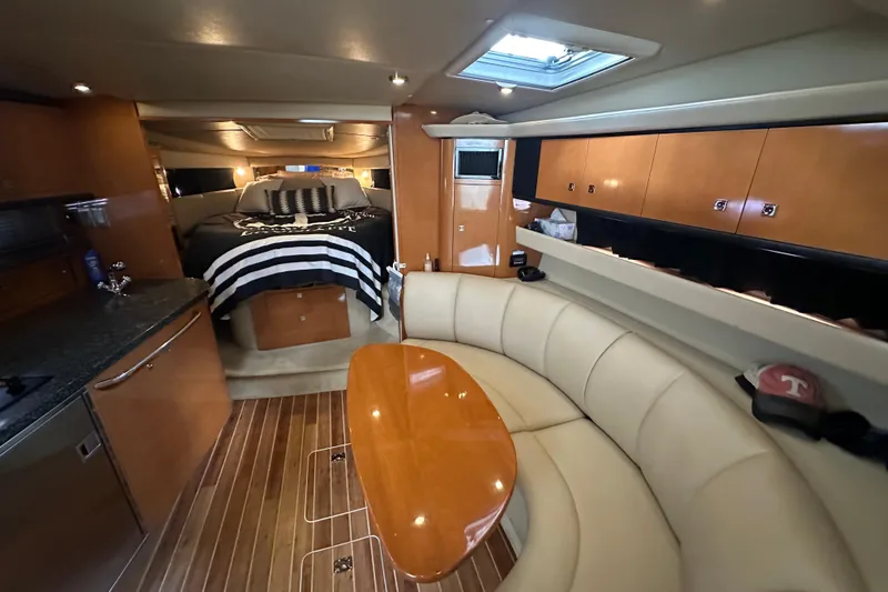 Slide: The Image of Luxurious interior of 2010 Chaparral Signature 370 yacht with cozy seating and elegant wood finishes. - 30