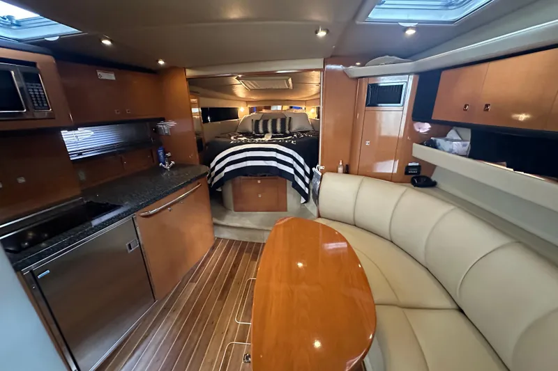 Slide: The Image of Luxurious interior of 2010 Chaparral Signature 370 yacht with kitchen and seating area. - 31