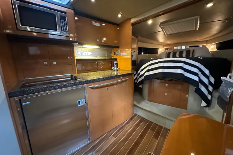Slide: The Image of Luxurious interior of 2010 Chaparral Signature 370 yacht with kitchenette and cozy sleeping area. - 37