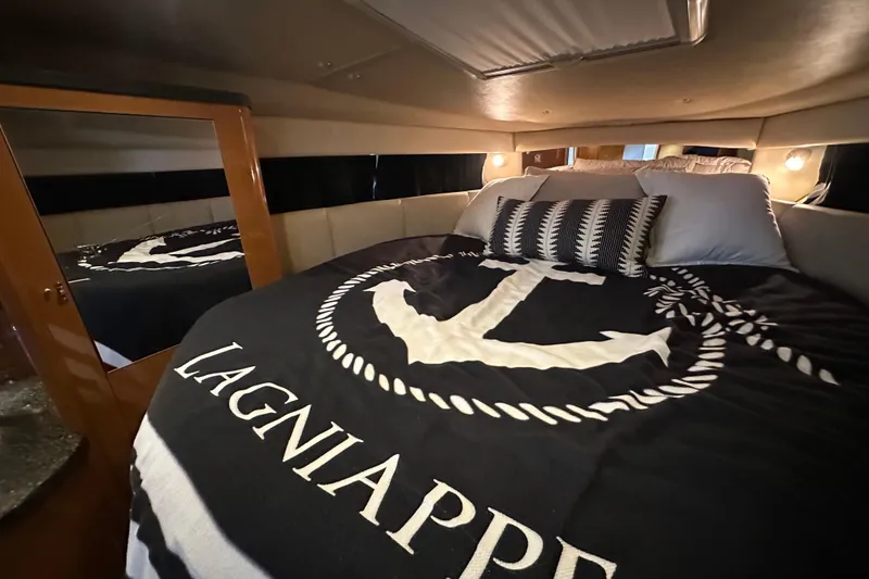 Slide: The Image of Cozy cabin interior of 2010 Chaparral Signature 370 with nautical-themed bedding. - 41