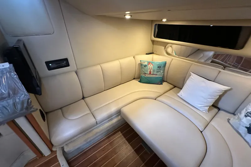 Slide: The Image of Luxurious interior of 2010 Chaparral Signature 370 yacht with beige seating and decorative pillows. - 45