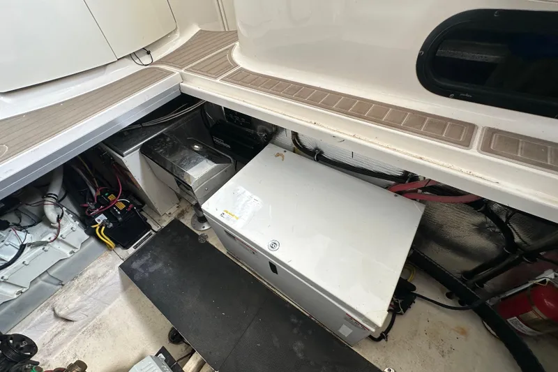 Slide: The Image of Engine compartment of 2010 Chaparral Signature 370 boat, showing equipment and wiring. - 59