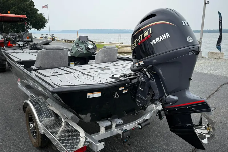 Slide: The Image of 2025 Avid 18 Vertex boat with Yamaha engine on trailer by the lake. - 3