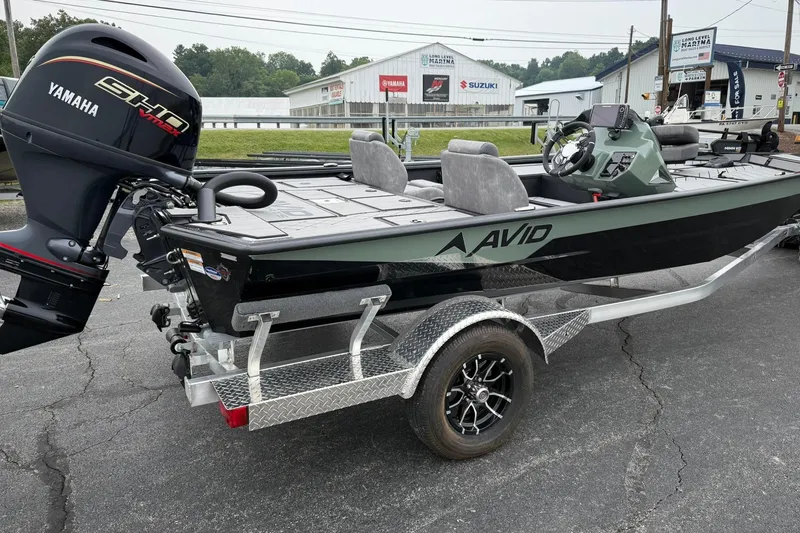 Slide: The Image of 2025 Avid 18 Vertex boat with Yamaha engine on a trailer, parked outdoors. - 4
