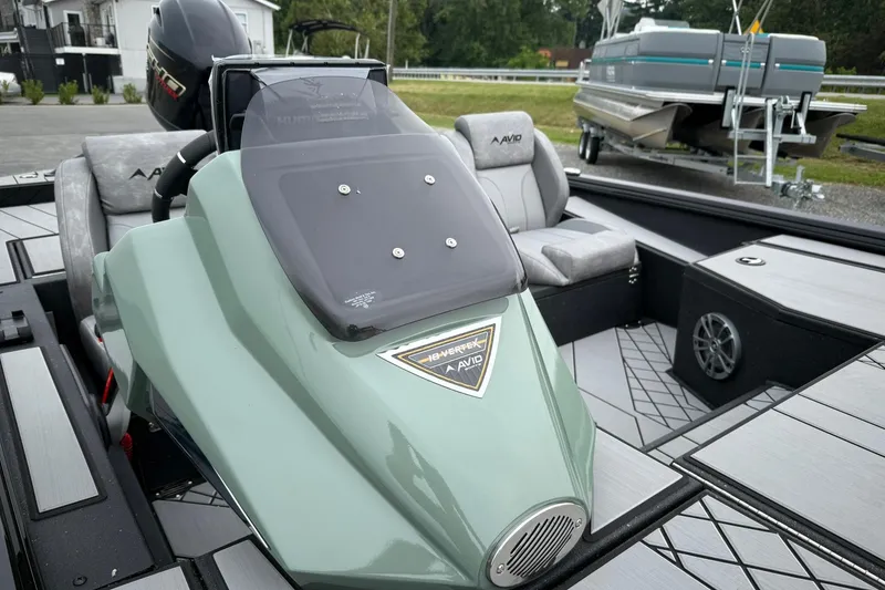 Slide: The Image of 2025 Avid 18 Vertex boat interior with modern seating and dashboard design. - 6
