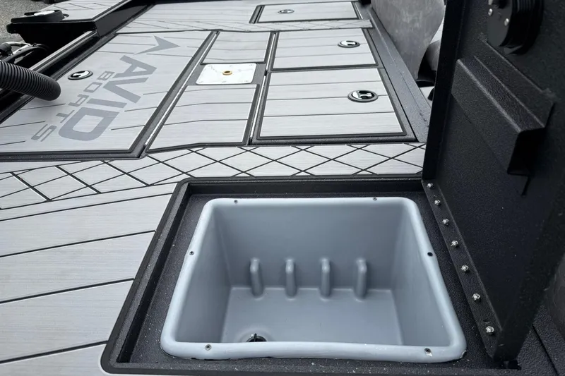 Slide: The Image of 2025 Avid 18 Vertex boat deck with storage compartment, featuring sleek design and durable materials. - 9