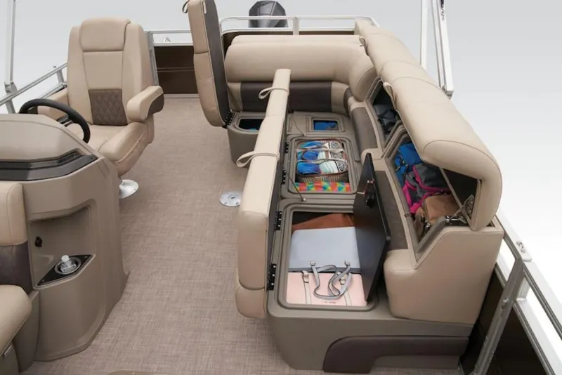 Slide: The Image of 2025 Sun Tracker Sportfish™ 24 XP3 interior with storage compartments open. - 11
