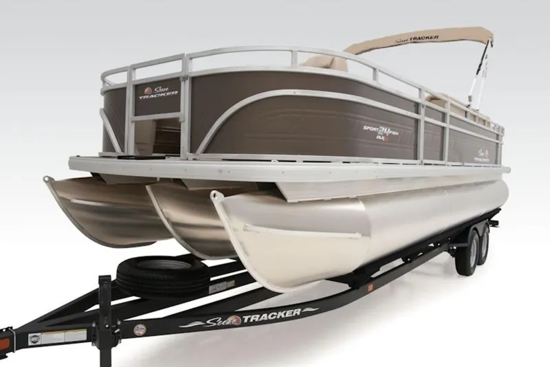 Slide: The Image of 2025 Sun Tracker Sportfish™ 24 XP3 pontoon boat on trailer, side view. - 6