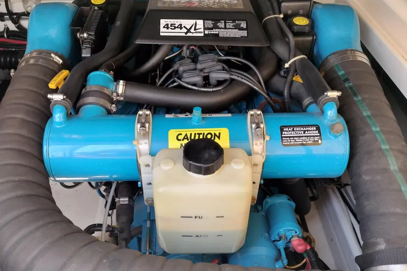 Slide: The Image of Engine compartment of a 1995 Tiara Yachts 2900 Open, featuring a Model 454XL engine. - 19