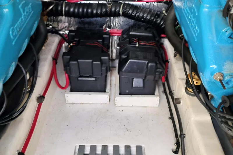 Slide: The Image of Engine compartment of a 1995 Tiara Yachts 2900 Open, featuring batteries and wiring. - 20