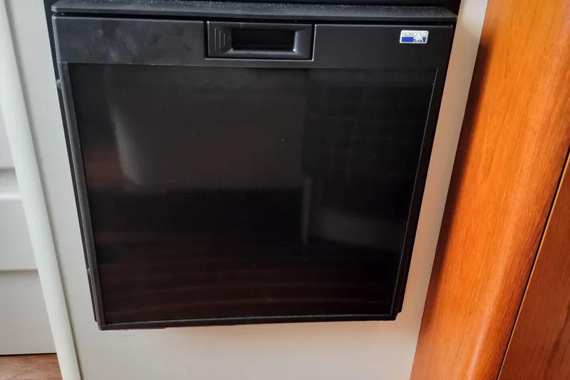 Slide: The Image of Black Norcold refrigerator on a 1995 Tiara Yachts 2900 Open. - 8