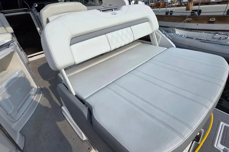 Slide: The Image of 2022 Regal 28 Express boat interior with adjustable seating and modern design. - 26