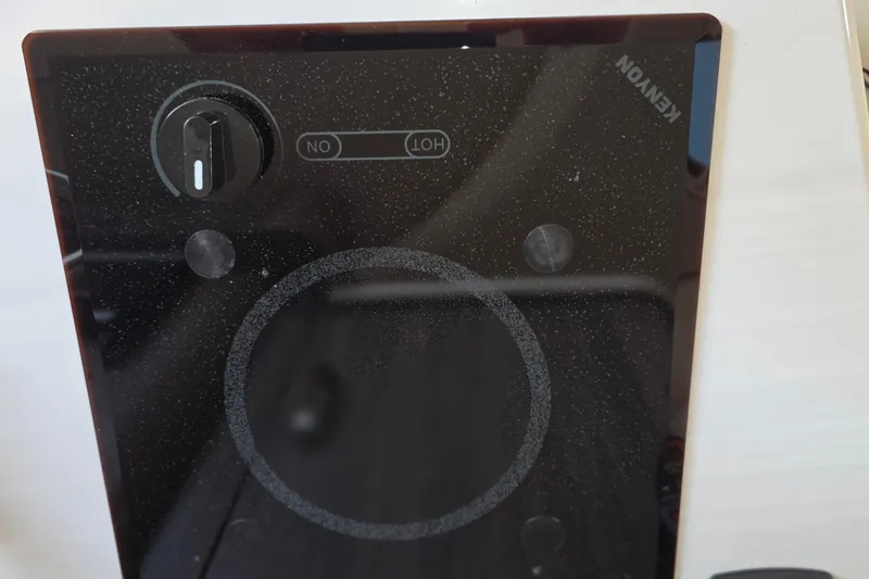 Slide: The Image of Control panel of a Kenyon cooktop on a 2022 Regal 28 Express boat. - 39