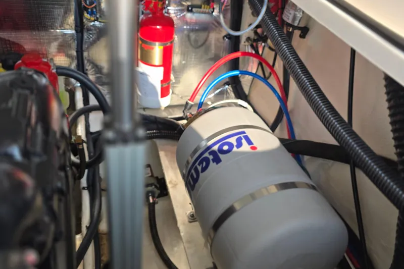 Slide: The Image of Engine compartment of 2022 Regal 28 Express with fire extinguisher and wiring. - 44