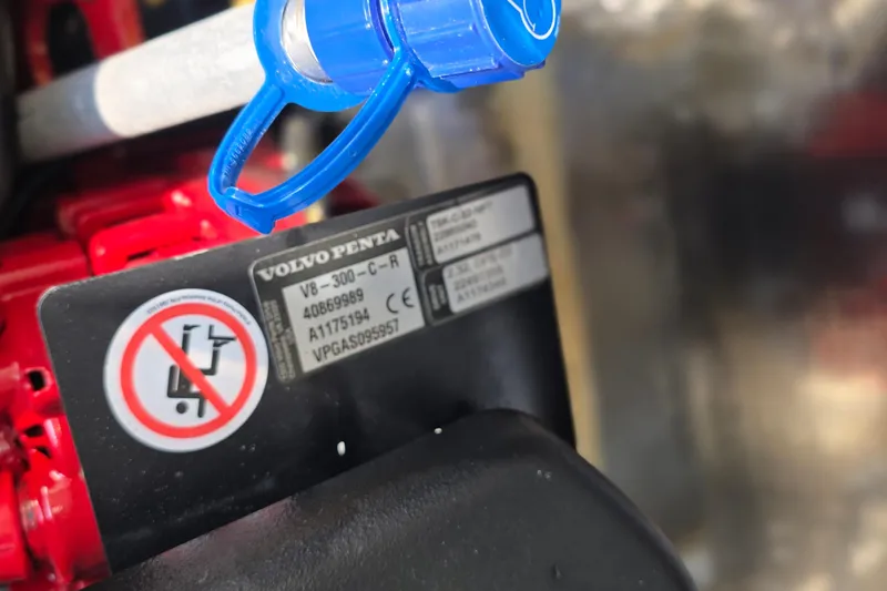 Slide: The Image of Close-up of Volvo Penta engine label on 2022 Regal 28 Express boat. - 47