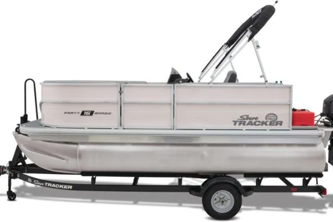 Slide: The Image of 2026 Sun Tracker Party Barge 16 DLX pontoon boat on trailer, side view. - 16