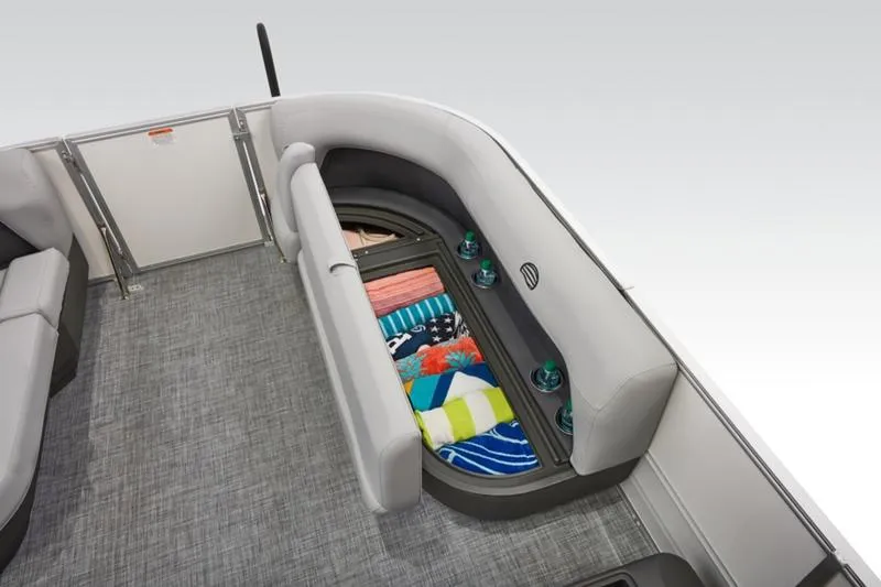 Slide: The Image of 2026 Sun Tracker Party Barge 16 DLX interior with storage and seating. - 19