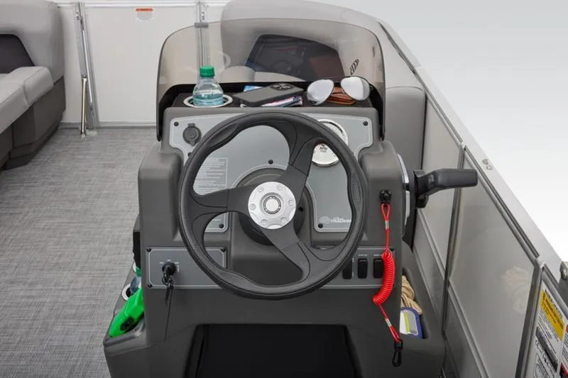 Slide: The Image of Steering console of 2026 Sun Tracker Party Barge 16 DLX with accessories. - 22