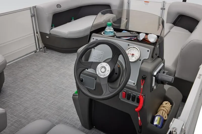 Slide: The Image of Interior of 2026 Sun Tracker Party Barge 16 DLX with steering console and seating. - 25