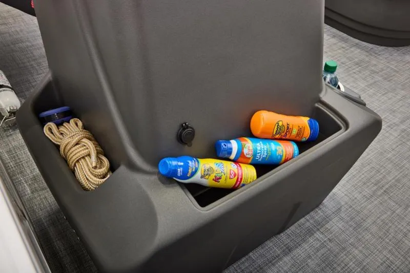 Slide: The Image of Storage compartment on 2026 Sun Tracker Party Barge 16 DLX with sunscreen and rope. - 27
