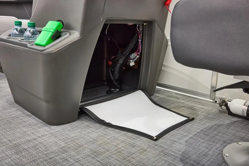 Slide: The Image of Interior of 2026 Sun Tracker Party Barge 16 DLX with storage compartment and cup holders. - 29