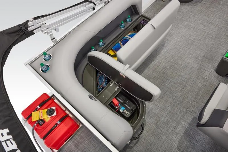 Slide: The Image of 2026 Sun Tracker Party Barge 16 DLX interior with storage compartments and seating. - 30
