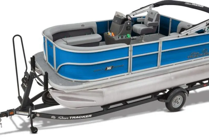 Slide: The Image of 2026 Sun Tracker Party Barge 16 DLX pontoon boat on trailer, blue and gray design. - 34