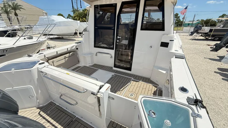 Slide: The Image of 2026 Cutwater C-288 Coupe boat interior with spacious deck and modern design. - 12