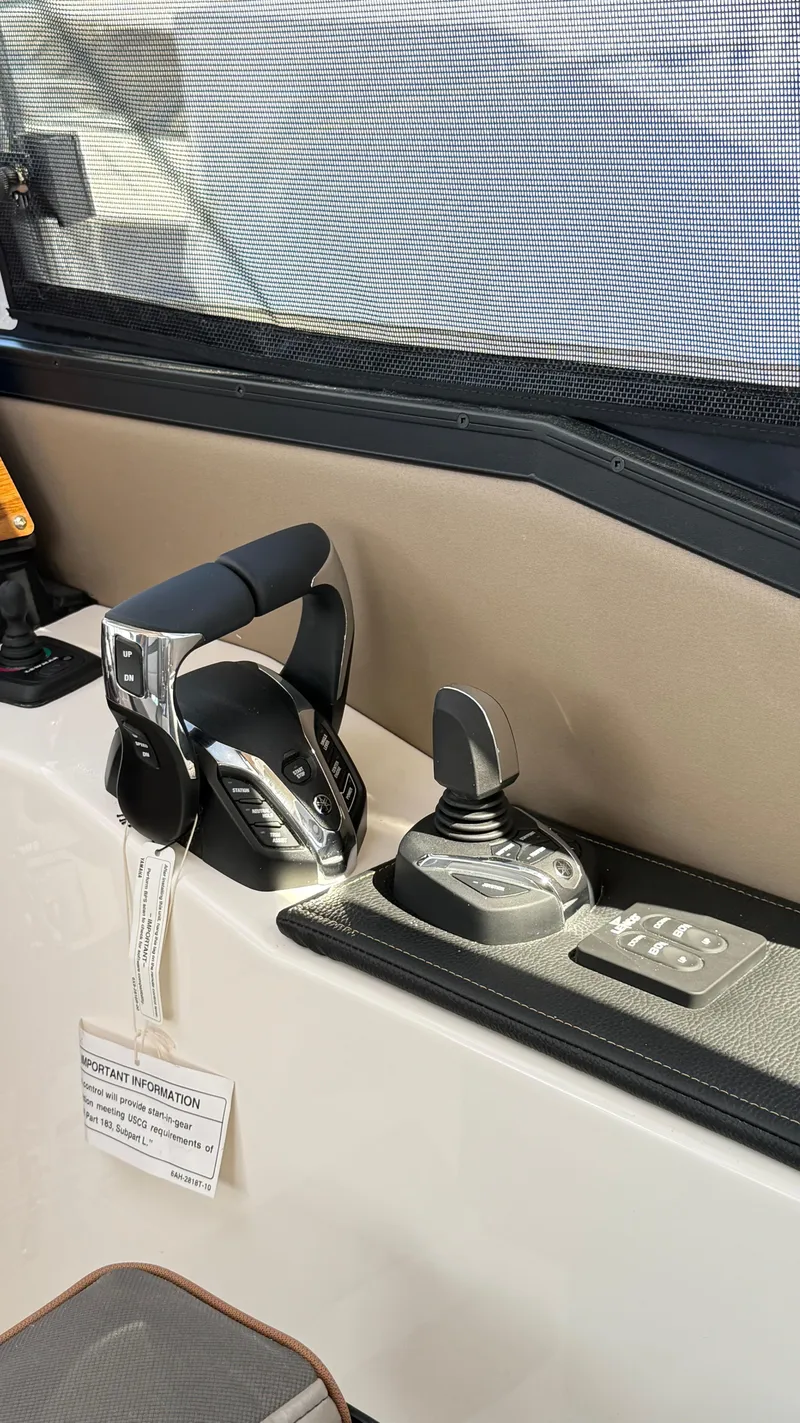 Slide: The Image of 2026 Cutwater C-288 Coupe control panel with throttle and joystick. - 20