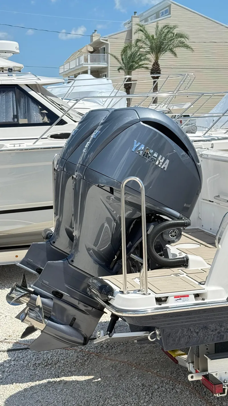 Slide: The Image of 2026 Cutwater C-288 Coupe with Yamaha outboard motor at a marina. - 7