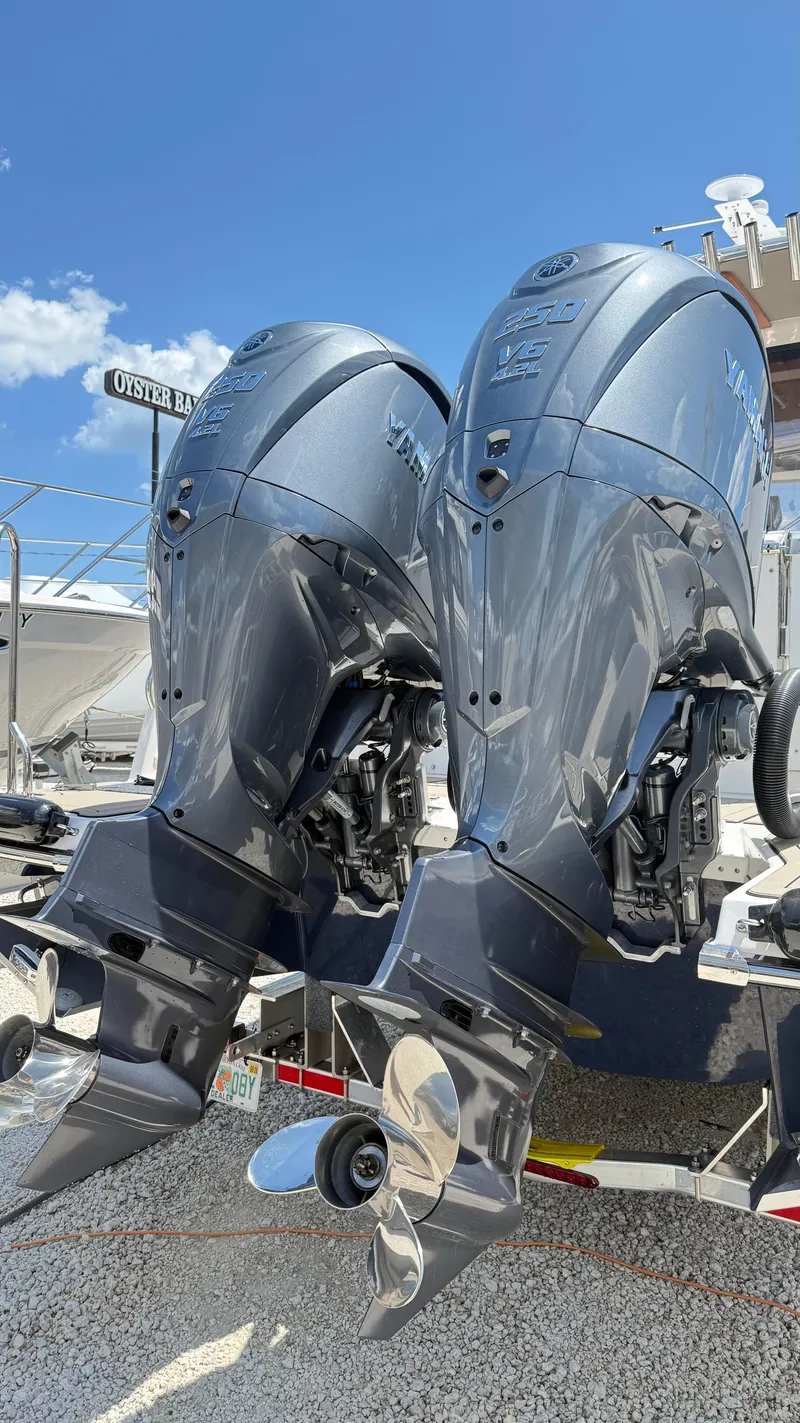 Slide: The Image of 2026 Cutwater C-288 Coupe with dual Yamaha V6 outboard engines, displayed outdoors. - 8