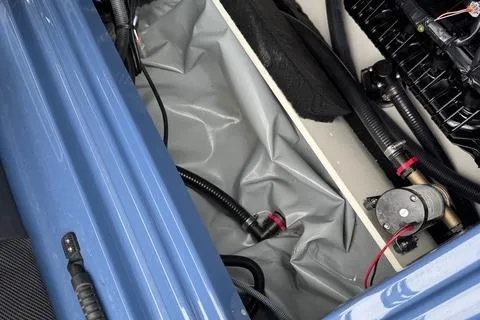 Slide: The Image of 2024 Yamaha Boats 222XD interior compartment with wiring and components. - 14