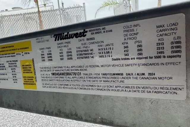 Slide: The Image of Label on a 2024 Yamaha Boats 222XD trailer, detailing safety standards and specifications. - 23