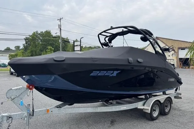 Slide: The Image of 2024 Yamaha Boats 222XD on trailer, covered, parked outdoors. - 4