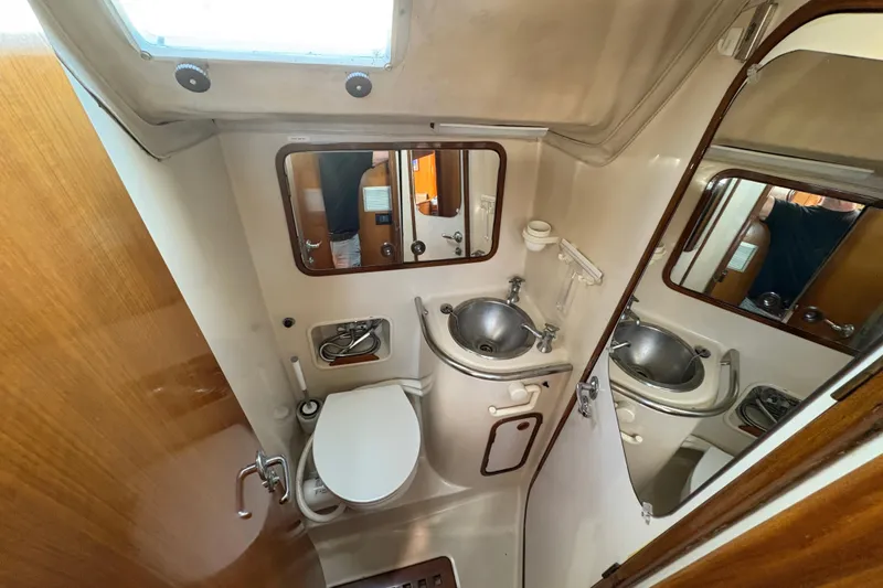 Slide: The Image of Bathroom interior of 1990 Beneteau Oceanis 500 yacht, featuring sink and toilet. - 87